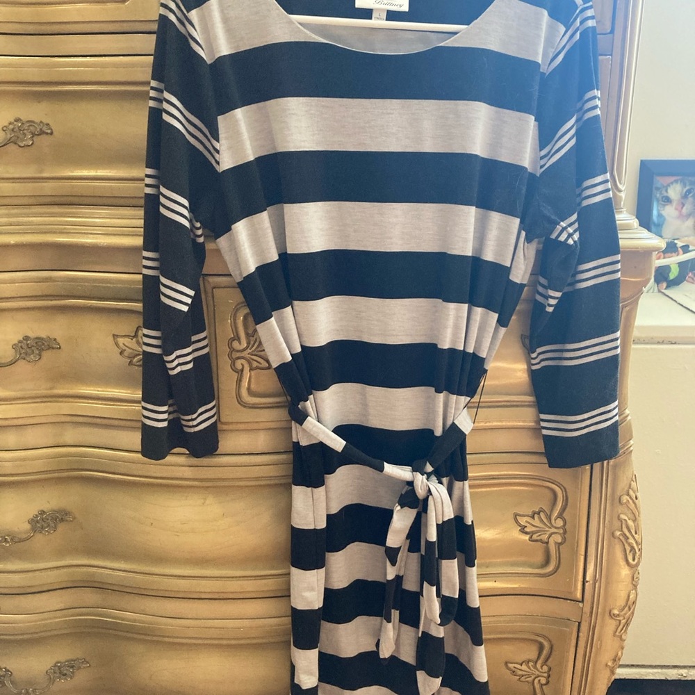 A black and Gray dress horizontal lines throughout the dress.